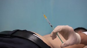 clip-29318839-doctor-prepares-injection-buttock