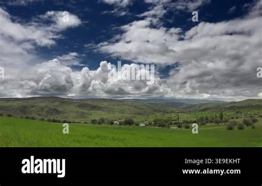 Timelapse farmland patchwork fields moving clouds cropland rural terrain detail. Accelerated sky reveals shifting light above cultivated parcels basin broad plains. agriculture, cultivated land, soil, open plains Stock Video Footage - Alamy
