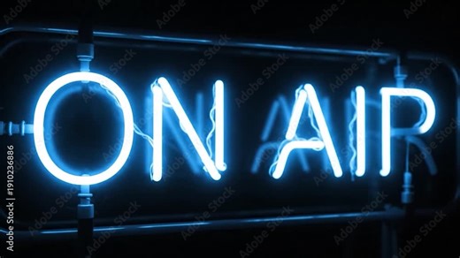 Bright blue neon sign glowing with 'ON AIR' text in a dark studio background