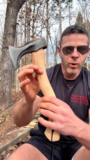 Solid wood handle camping ax with a forged steel head and built in wedge for faster firewood