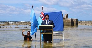 Tuvalu minister gives COP26 statement in seawater to highlight rising sea levels from climate change