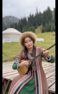 A dombra performance by Kazakhstani musician Aididau. | Dust-to-Digital
