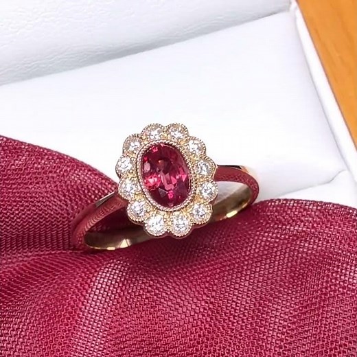 Oval shaped red real ruby and real diamond yellow gold cluster ring