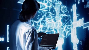 Competent manager in data center running programming scripts on laptop, solving tasks. Licensed specialist manipulating lines of code for artificial intelligence applications development