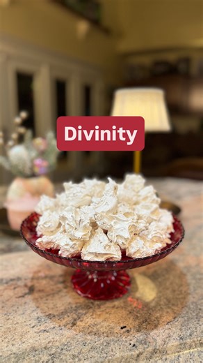 Divinity 2 1/2 cups of sugar 1/2 cup light corn syrup 2 egg Whites 1 tsp vanilla 1/4 tsp salt 1 cup pecans, chopped 1/2 cup of water In a heavy 2 quart sauce pan, combine sugar, corn syrup, 1/2 cup water and 1/4 teaspoon of salt. Cook without stirring until sugar dissolves and mixture boil. Cook over medium heat to 260°(hardball stage). As temperature 250°, be egg whites until stiff peaks form in a large mixing bowl. Gradually pour hot syrup in a thin stream over egg whites, beating at high spee