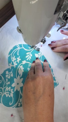 I'm layering my heart blocks for the rag quilt. Typically, the bottom is cotton, the middle is flannel, and the top is cotton. I'm using my client's late mother's clothing for the top, which are hearts. #RagQuilt #IveGotYouCovered | I've Got You Covered