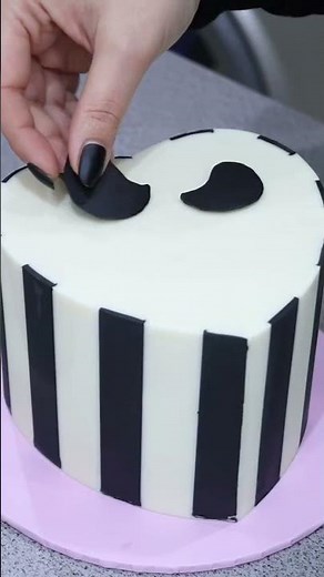 Creating a Spooky Halloween Cake with Stripes and Skulls