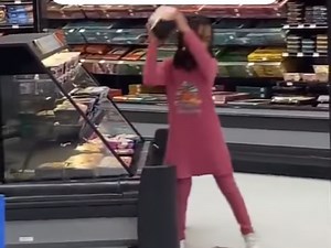 Young girl trashes supermarket while shoppers watch on