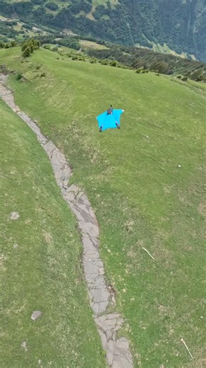 Wingsuit Flying Over Swiss Alpine Meadows