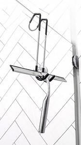 How to prevent buildup on glass shower doors! Wipe down the glass after every use with a Shower Wiper. Ideal for use on tiled surfaces, mirrors, & windows. Includes both an over shower door holder as well as a wall mounted hook for storage. #shower #bathroom #cleaning | Gelmar Home Improvement