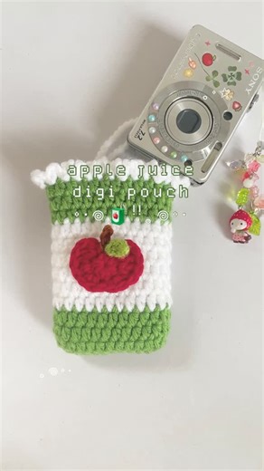 wisteria crochet ૮꒰•༝•꒱ა on Instagram: "𖦹🧃ᵎᵎ｡𖦹°‧ apple juice digicam pouch 🍀 pattern is now available in my bio link heheh >