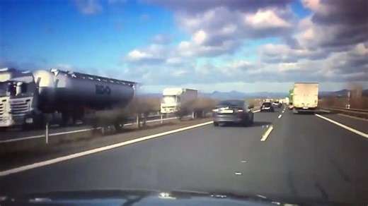Cars Narrowly Escape Crashing Into Truck Approaching From Opposite Direction as it Flips Over
