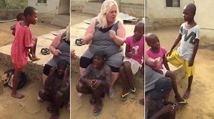 Children and carers sing together at Anja's Nigerian refuge