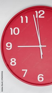A Red Wall Clock With The Time Of 9.00 Am Or Pm. A White Hands Of The Clock, The Concept Of Time. Vertical.
