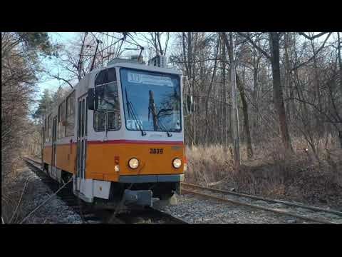 Tram T6 is passing through a forest. SOFIA, BULGARIA