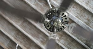 closeup fan or ventilator blower or blowhole on ceiling, inroom, electric device