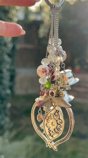 Melissa Tavernier on Instagram: "It all begins with intention. Each bell begin as a quiet ritual at my bench. Each witch bell is assembled slowly, by hand, with the intention it’s meant to hold. Every charm, stone, and symbol is chosen with purpose — working together in harmony. They’re meant to become part of your rituals. Small guardians of sound and intention. @stampitoutloud13 #stampitoutloud13 #newyear #handcrafted #protection #thankful"