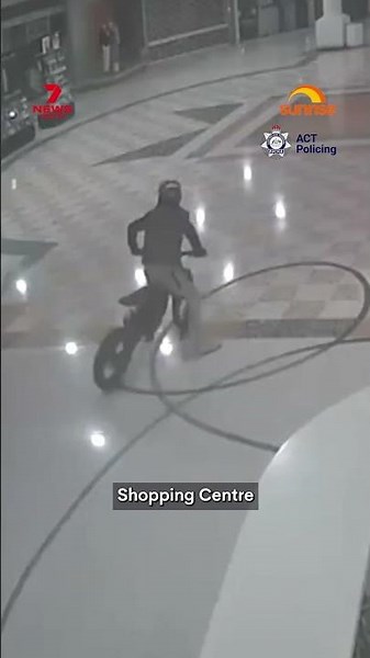 Police hunt for e-bike hoons after shopping centre stunt in ACT | 7NEWS