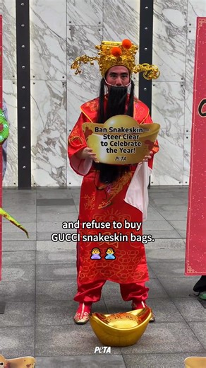 🐍✨ Ahead of the Year of the Snake, PETA Asia’s “God of Wealth” called on @Gucci to stop selling accessories made from snakes’ skins. A PETA investigation revealed that pythons are bludgeoned, impaled, and skinned alive for fashion. Urge Gucci to switch to cruelty-free, vegan materials: PETAAsia.com/Python | PETA Asia