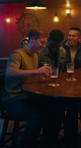 🎖️ WE THOUGHT THE WOMAN IN THE CORNER WAS A NOBODY. THEN WE SAW HER TITLE. There were four of us, fresh off the bus at the base, thinking we were the toughest men on earth. We found the first dive bar that would serve us. It was dark, smelled like old beer, and we loved it. We were loud. In the corner booth, a woman sat alone. Gray hoodie, drinking a glass of water. She looked tired, plain. Invisible. My buddy Mike, trying to show off, stumbled and sent half his beer sloshing onto her table. We