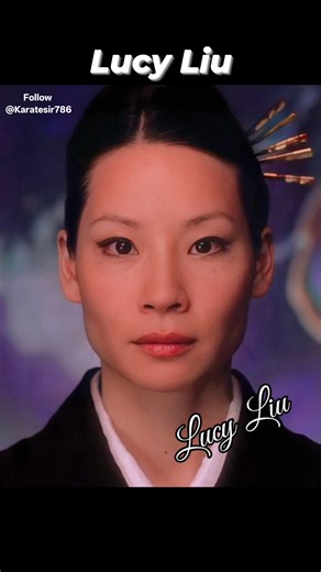 This image shows actress Lucy Liu as the character O-Ren Ishii from the 2003 film Kill Bill: Volume 1. Character Information In the film, O-Ren Ishii (codename: Cottonmouth) is a major antagonist and the supreme leader of the Tokyo Yakuza. She was a former member of the Deadly Viper Assassination Squad and is the first target on the Bride's "Death List Five". Iconic Look & Costume The specific outfit shown in the image is her black kimono with a white underlayer. Costume Design: Lucy Liu persona