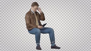 Man sitting with PC tablet. Green screen footage. File format - .mov. Codec - PNG+Alpha. Combine these footage with your background or other people