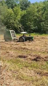 John Deere 2030 and 530 Baler still rolling it up.