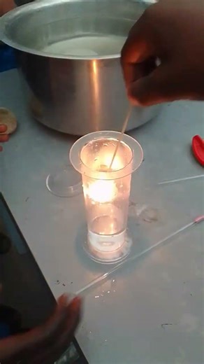 oxygen gas relights a glowing splint.Balozi junior academy practical, production of oxyegen