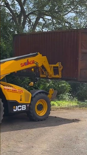 Moving 20ft container using telehandler