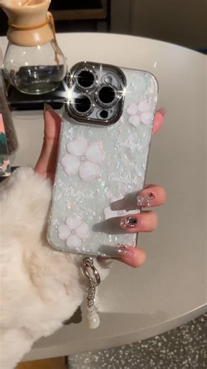 Premium Case on Instagram: "Shimmer like moonlight with this Mother-of-Pearl Floral Case 🌸 ✨ 3D Four-Leaf Clover 💫 Engraved Wishes: “Be Happy, Wish Rich, Goodluck” 🌟 Diamond-studded charm ring 🧵 Comes with luxe pearl strap 📝Taking pre-orders! 📩Inbox to order: m.me/premiumcase23 📱Available for iPhone models: 17, 17 Air, 17 Pro, 17 Promax 16, 16 Plus, 16 Pro, 16 Pro Max 15, 15 Plus, 15 Pro, 15 Pro Max 14, 14 Plus, 14 Pro, 14 Pro Max 13, 13 Pro, 13 Pro Max 12, 12 Pro, 12 Pro Max 11, 11 Pro,