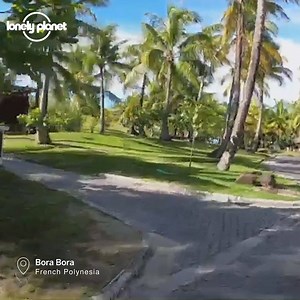 Even though it's not a good idea to travel right now, that doesn't mean you can't imagine yourself doing it. Let us help with this bike ride in Bora Bora. | Lonely Planet