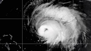 What is the difference between a tropical storm and a subtropical storm?