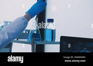 scientist with a flask in a lab.