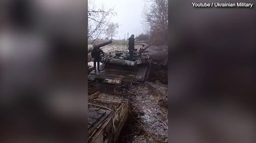 Footage shows column of abandoned Russian tanks stuck in the mud