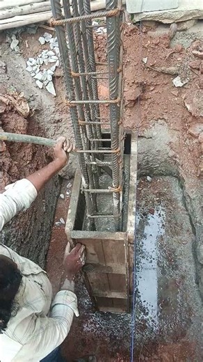 column pedestal concrete work. using concrete vibrator
