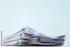 24 FPS 4K Stop motion of close-up stack overload document report paper with paperclip place decrease on white background, business and education concept footage paperless used.