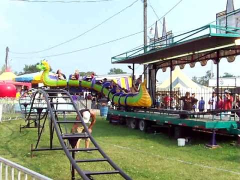 AJ riding Dragon Wagon at the Fair
