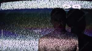Mind control. TV propaganda. Brainwash manipulation. Silhouette of hypnotized shirtless man in analog static noise glitch television channel countdown projector light.