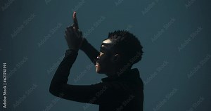 Musician: The woman uses hand and arm movements to create rhythmic patterns and conduct music, showcasing her skills as a percussionist or conductor.