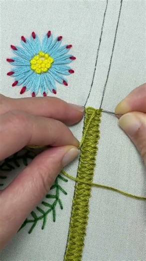 the process of sewing a beautiful piece of cloth using manual stitching