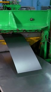 Stamping of sheet steel parts on a hydraulic press. Stamping on the press. Rolls of sheet steel for press forming of products in the factory. Steel sheet in coils.