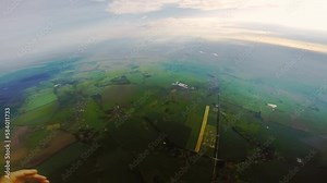 Skydiver takes actions to unfasten drogue chute for flight