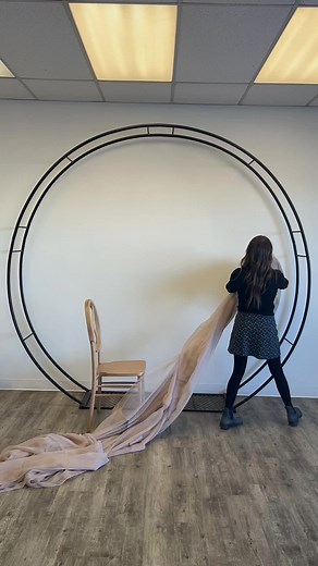 STEP X STEP how to drape our circle ARCH using two 12ft double voile panels! Drape is a beautiful way to dress up our arches…however sometimes its hard to know the exact placement to make the drape look like this! SAVE this video for an easy on site setup at your next event! #wedding #weddingreels #weddingarch #weddingdrape #regina #yqr #arch #circlearch #stepbystep