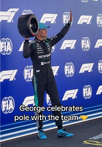 George Russell celebrates pole with Mercedes handshake