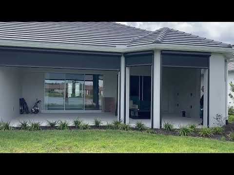 Motorized Screens Turn This Large Patio Into a Year-Round Outdoor Living Space in Tampa Bay