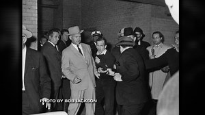 He was the man trying to protect Lee Harvey Oswald