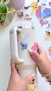 Showing how easy it is to reposition a sticker on a silicone surface! 🤩 The soft silicone-y material on a Stanley cup actually makes it really easy to reposition one of our stickers & decals! One of my fav materials to stick stickers on 🙈 Consider supporting a small biz and shop from our website WishUponMagic.com 💖 Pro-tip: Use “Sticker15” on orders over $15, add an extra freebie sticker to your cart, *then* apply the code. This code only works for our website, not for our Etsy store! 💖 #dis