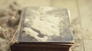 Wind blowing dust of a dirty musty old book