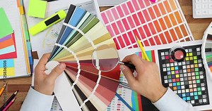 Designer and color palette with magnifying glass