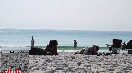 Girls can't stop laughing on the beach